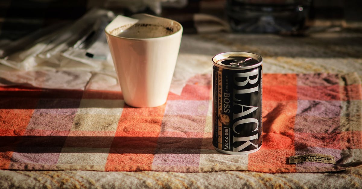 Can Cuban coffee be approximated? - Black Boss Can on Top Beside White Mug