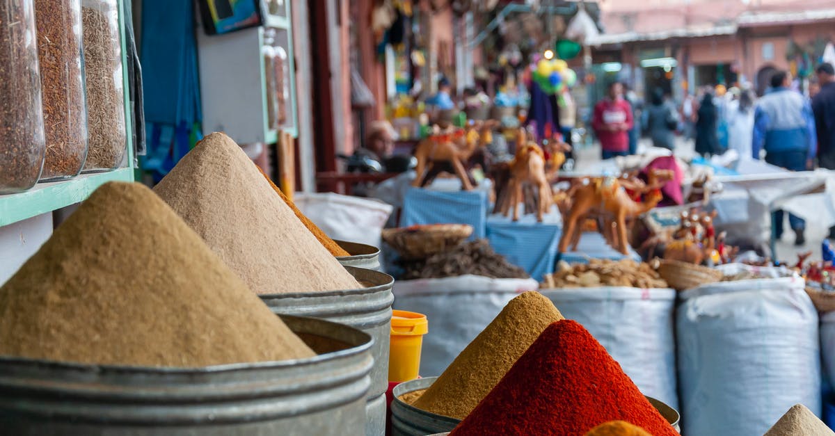 Can cultured buttermilk powder contain live cultures? - Metal containers with heaps of assorted aromatic colorful spices placed on stall in local outdoor market