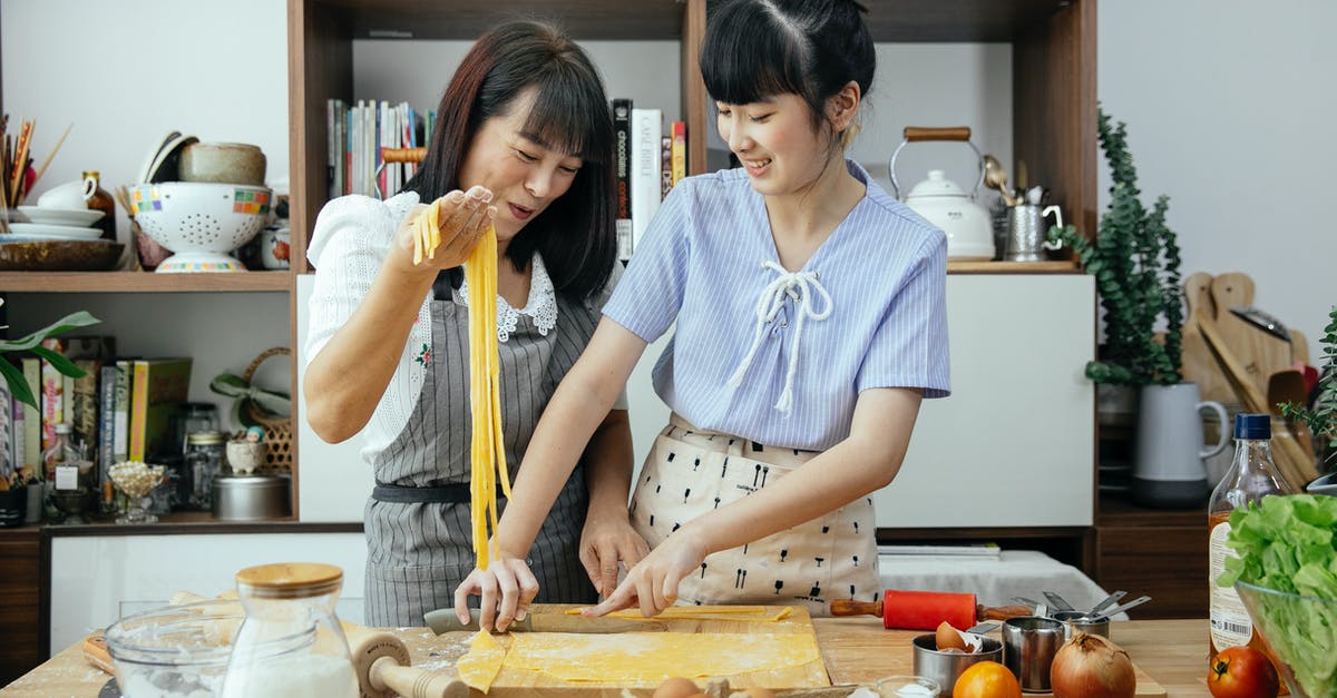 Can handmade pasta be more than just flour + eggs? - Smiling women making noodles in kitchen