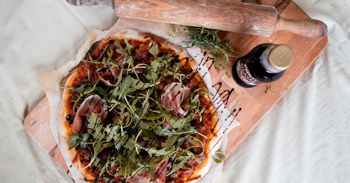 Can homemade vinegar be safely sealed in a bottle? - Prosciutto Pizza on Wooden Chopping Board