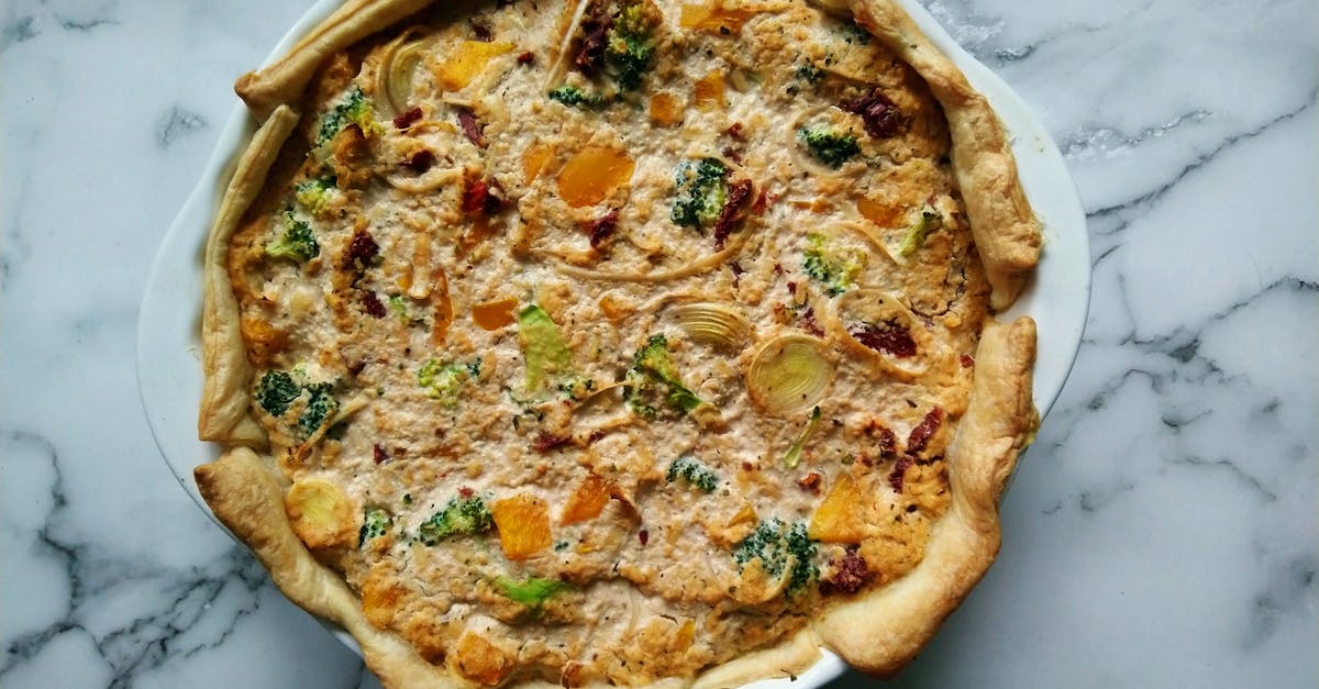 Can I bake a quiche with a flaky crust? - Quiche Tart on White Ceramic Plate