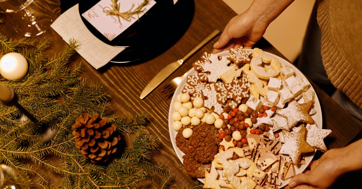 can i bake pine nuts? - Person Serving a Platter of Homemade Biscuits