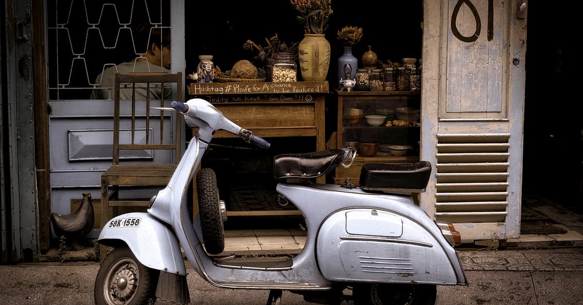 Can I continue to age store bought cheese? - White and Black Motor Scooter Parked Near Building