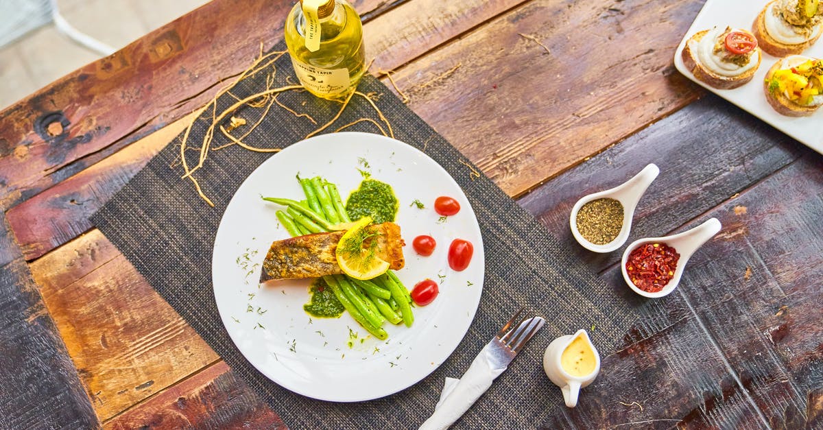 Can I fry food with solely essential lemon oil? - Grilled fish steaks served with vegetables and sauces