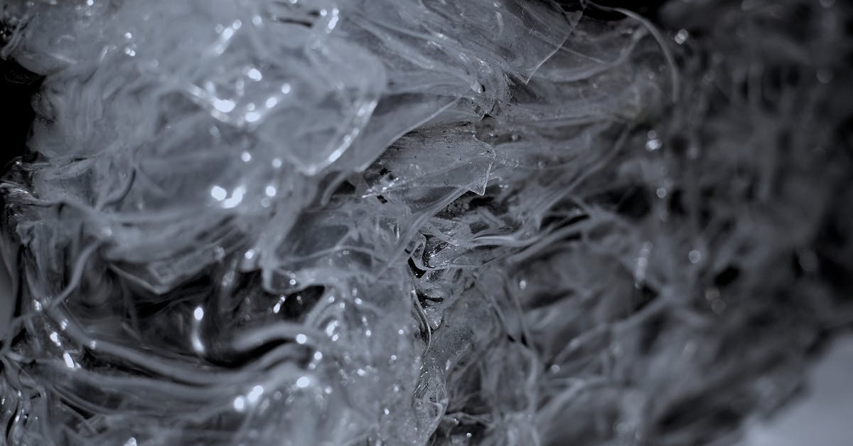 Can I fry my frozen Maitake pieces with other fresh mushrooms? - Abstract background of frozen surface with ice surface creating clean transparent shapeless texture