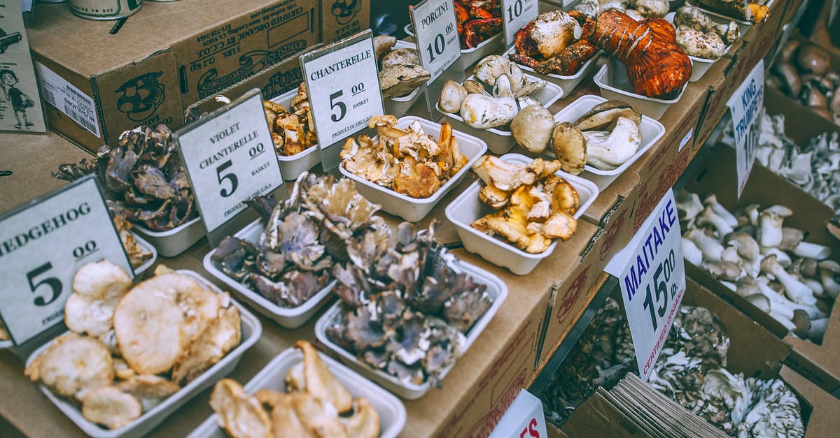 Can I fry my frozen Maitake pieces with other fresh mushrooms? - Assorted mushrooms on counter in market