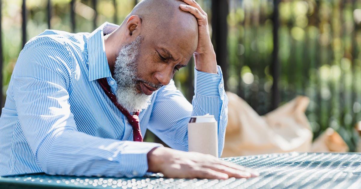 Can I increase the cocoa content in fudge? - Thoughtful black man sitting at table in veranda