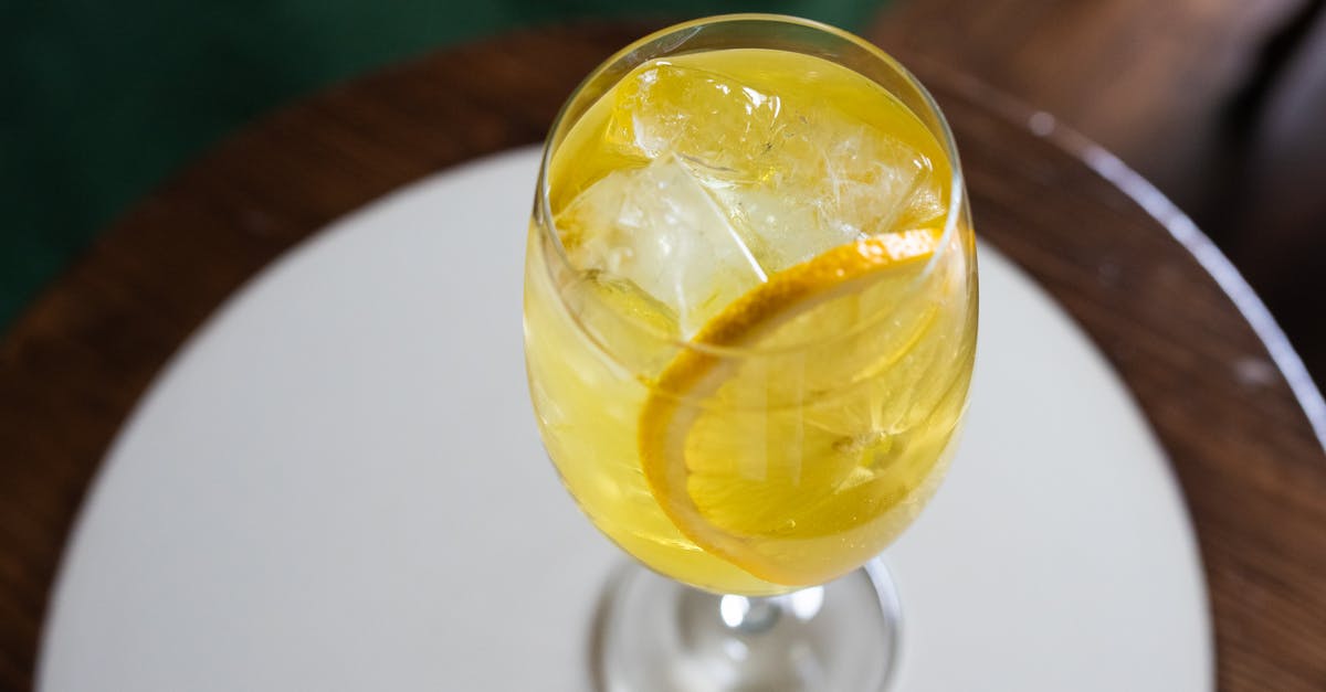 Can I layer Lemon curd and Lemon Mousse? - Clear Wine Glass With Yellow Liquid