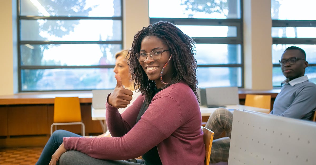 Can I learn to like wine? - Black woman showing thumb up to camera