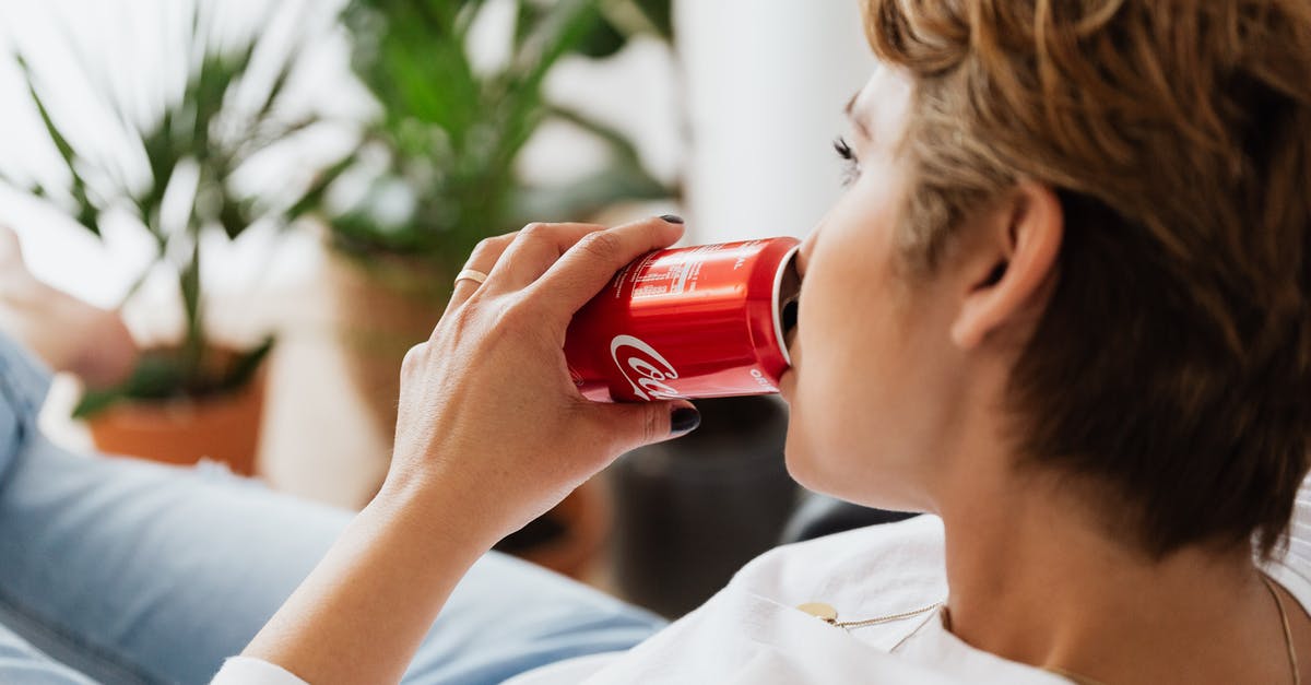 Can I leave boneless chicken breast flat in freezer overnight? - Crop unrecognizable thoughtful female enjoying coke while resting at home