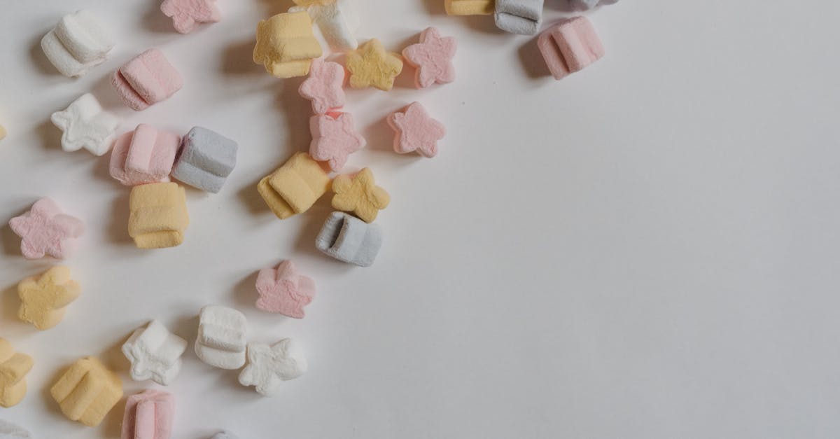 Can I make gelatin from bones without beef flavor? - Top view arrangement of multicolored yummy marshmallows in shape of stars scattered in corner of white paper