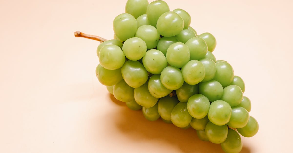 Can I make grapes honey from grape juice only - Fresh ripe green grapes on beige background