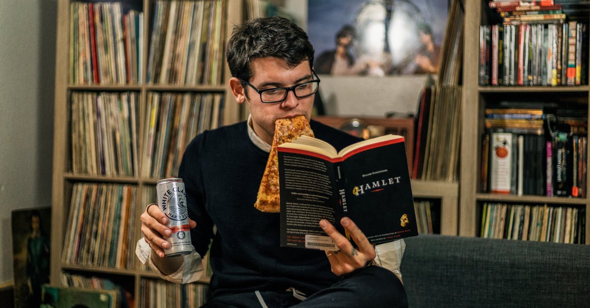 Can I make microwave frozen ready pizza? - A Man Eating Pizza Reading a Book of Hamlet