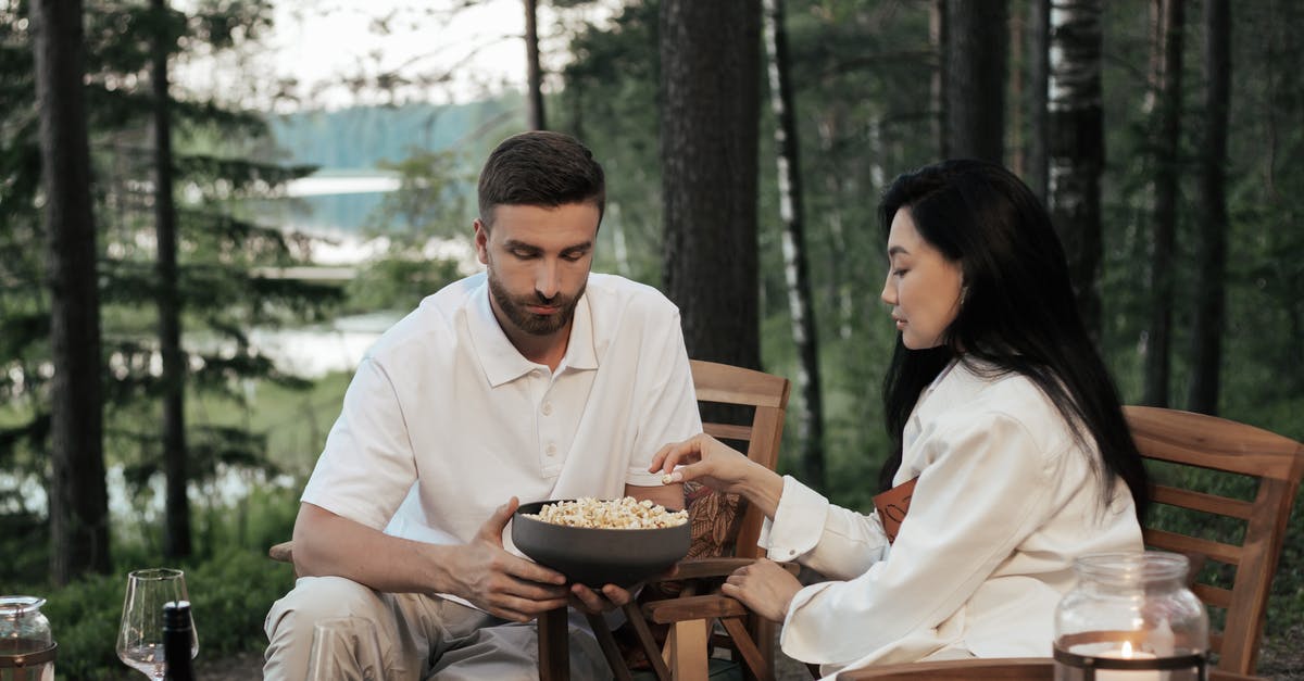 Can I make popcorn with any corn? - Man in White Dress Shirt Sitting Beside Woman in White Dress Shirt