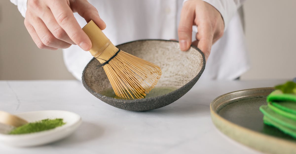 Can I mix food grade lye (sodium hydroxide) with water to make kansui? - Crop unrecognizable cook in white shirt mixing dry food coloring with water in bowl using whisk on table with green pancakes
