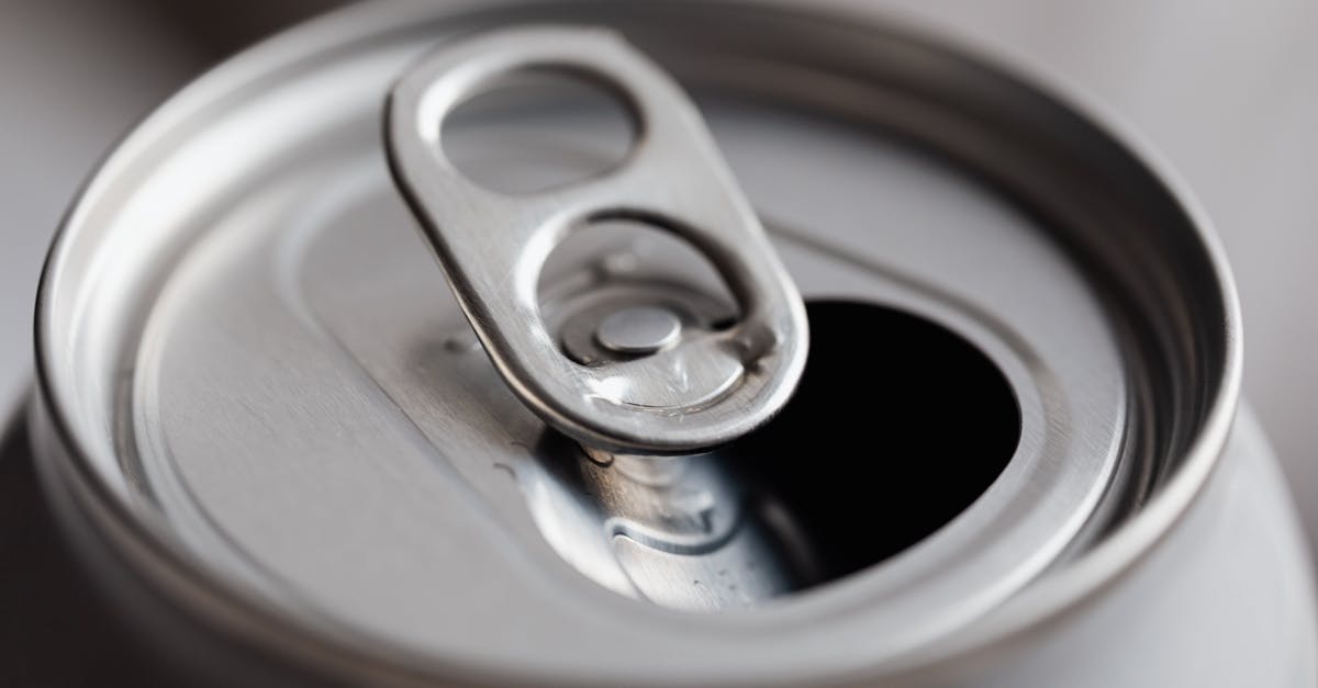 Can I put a disposable aluminum pan directly over a burner? - Open grey metal soda can