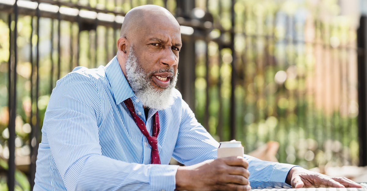 Can I replicate these Cafe Noir cookies? - Sullen black man sitting at table with drink