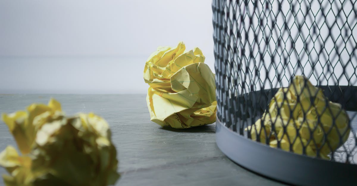 Can I reuse dessicant? - Focus Photo of Yellow Paper Near Trash Can