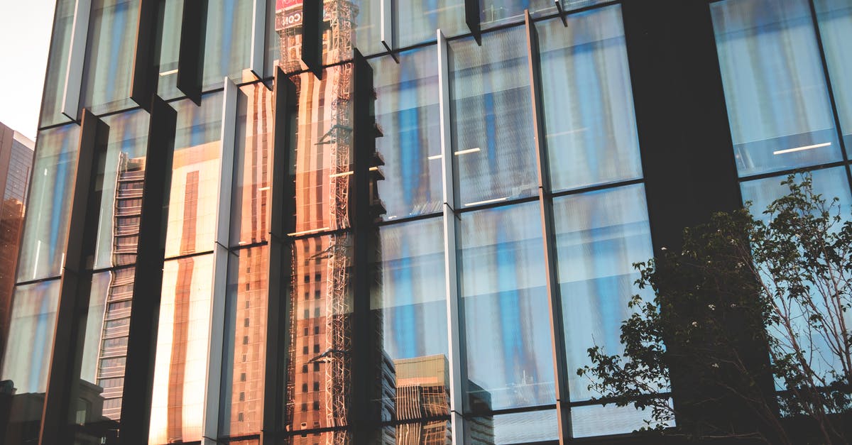 Can I still save my solid block of jam? - Modern facade of building reflecting street of city