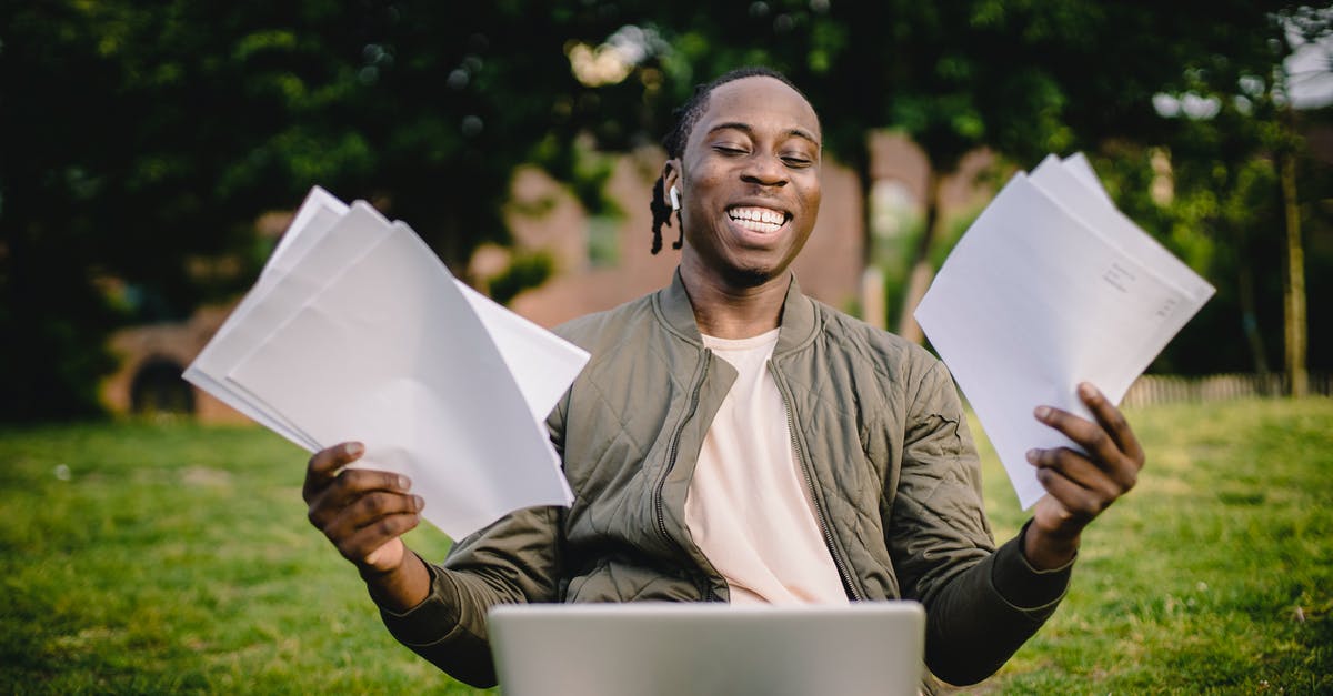 Can I substitute green cardamon for black cardamon in curry? - Student with documents and laptop happy about getting into university