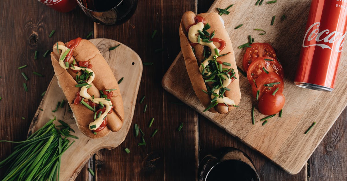 Can I un-seal canned tomato sauce, and re-seal after further cooking? - American Style Hot Dogs and Cans of Coca-Cola