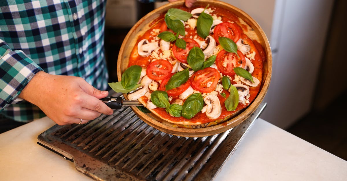 Can I un-seal canned tomato sauce, and re-seal after further cooking? - Person Holding Brown Ceramic Bowl With Vegetable Salad