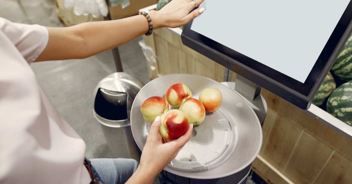 Can I use a fresh peach in place of preserves? - From above of unrecognizable woman touching screen of electronic scales and putting peaches while weighing peaches on scales in contemporary supermarket