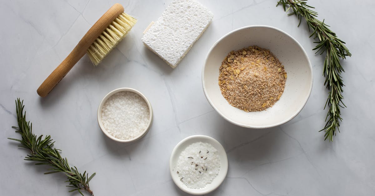 Can I use a rice cooker with flavored rice boxes? - Top view of bowls with ingredients for organic scrub arranged with pumice stone and fresh branches of rosemary
