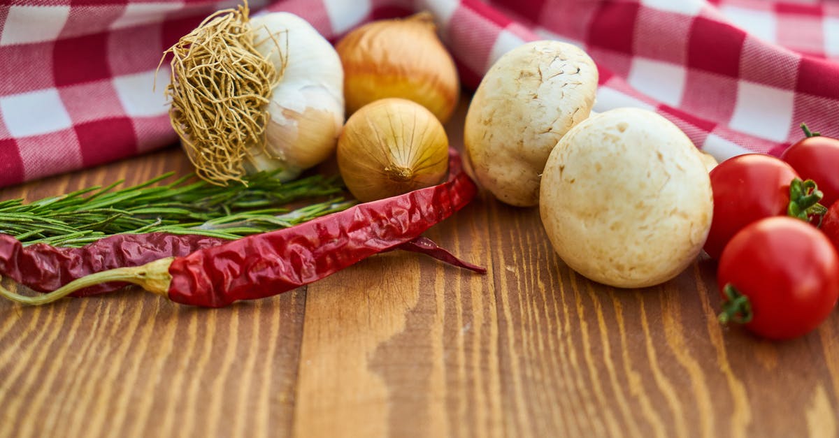 Can I use garlic leaf for cooking? - Onions, Garlic and Tomatoes Close-up Photo