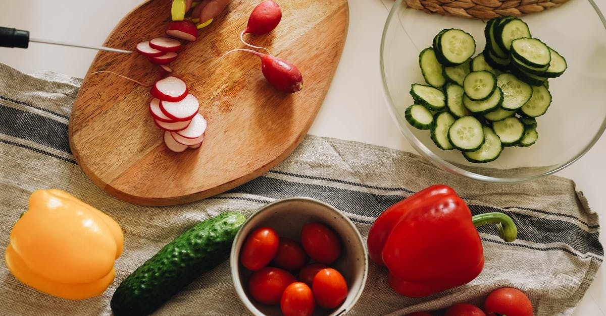 Can I use garlic leaf for cooking? - Sliced Tomato and Cucumber on Brown Wooden Chopping Board