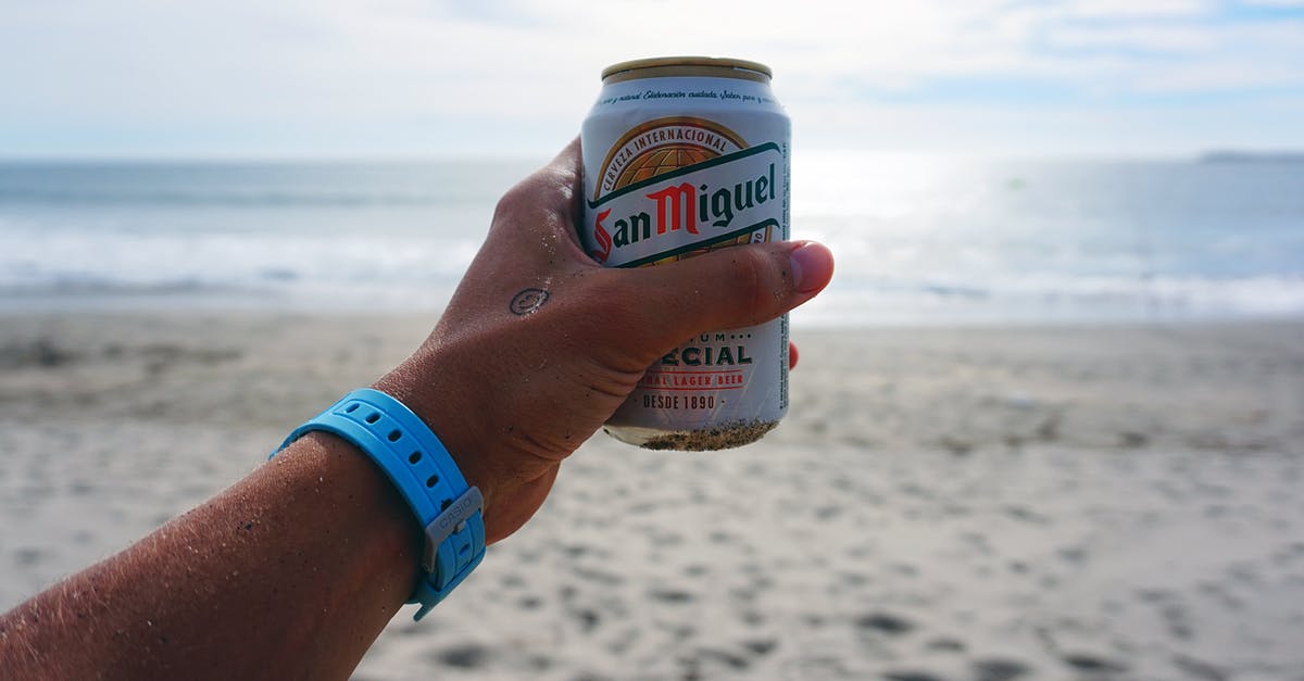 Can I use ocean water to cook my pasta? - Person Holding San Miguel Beer Tin Can