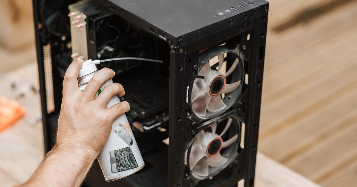 Can I use the juice from pickles to make bread? - Crop unrecognizable man cleaning computer system unit