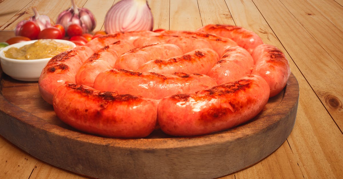 Can I use the same board for meat and vegetables? - Sausages on Top of Brown Wooden Board