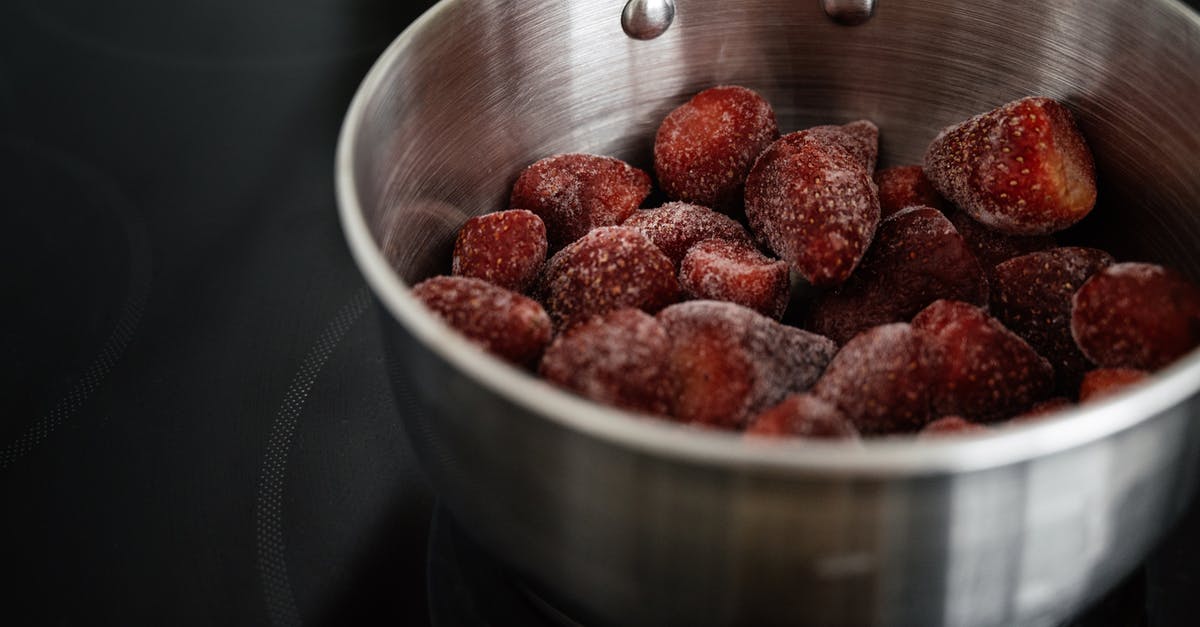 Can jam be made from frozen berries? - Shiny metallic bowl with frozen strawberry