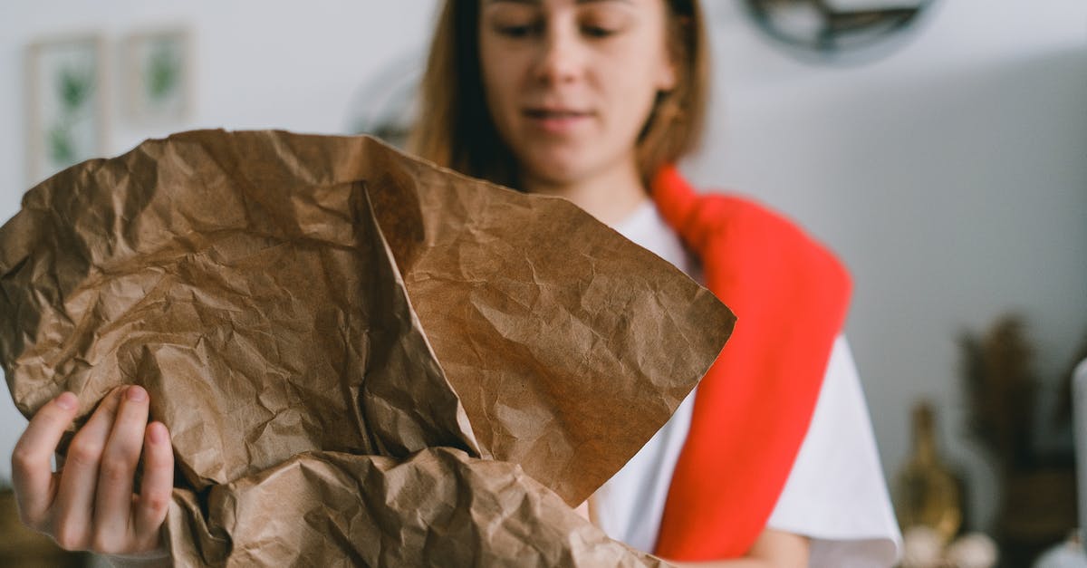 Can lemon juice concentrate be used after the use-by-date? - Crop female folding paper while sorting garbage for recycling to reduce pollution of planet