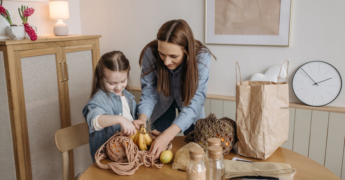 Can mashed bananas be bagged and then frozen? - Woman and Child Unpacking Fresh Fruits 