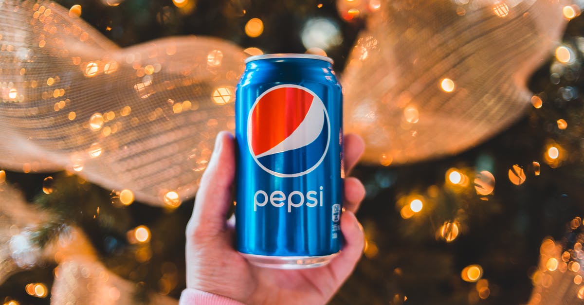 Can one create any flavor combination by breaking down the five modalities of taste into their chemical form and adjusting proportions accordingly? - Crop unrecognizable person showing colorful can of refreshing drink during New Year holiday