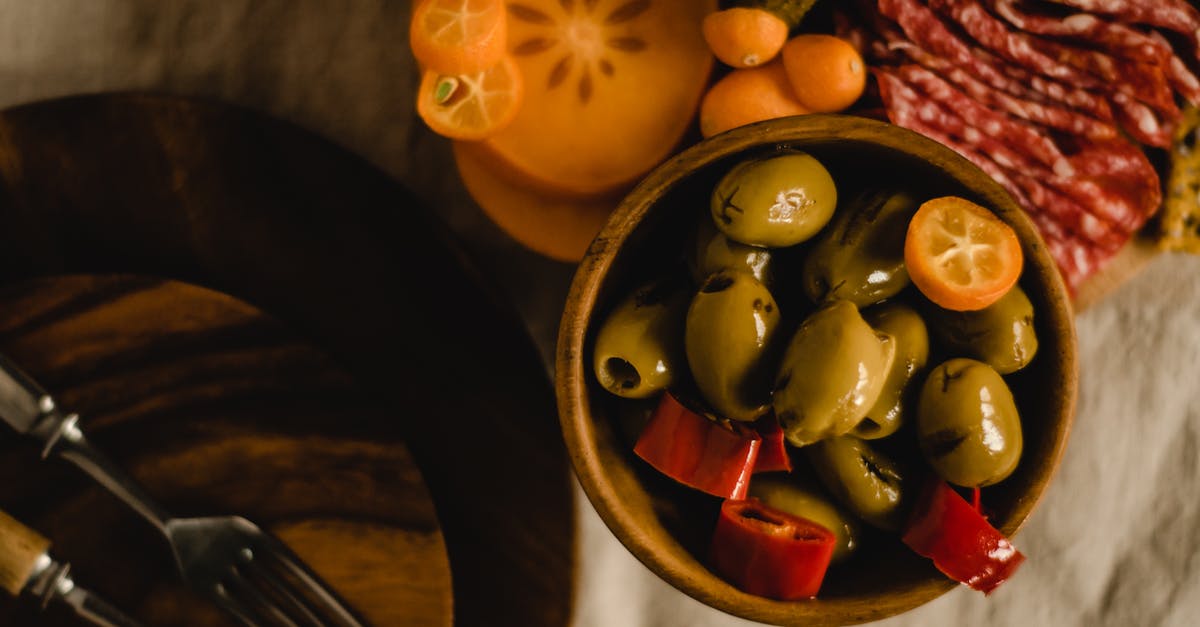 Can pickled pepper oil be used as cooking oil? - Sliced Fruits on Brown Wooden Bowl