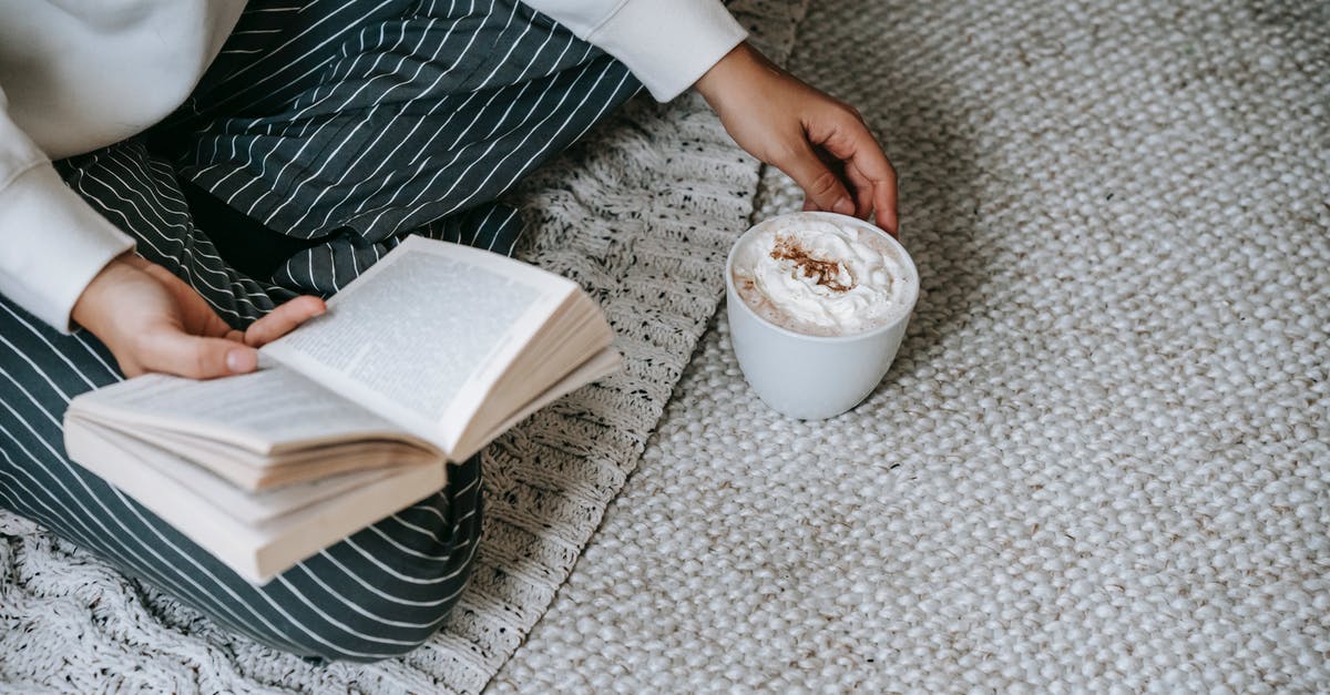 Can ruined whipped cream be rescued? - From above of crop anonymous female sitting with crossed legs and reading book with mug of coffee with whipped cream while resting at home