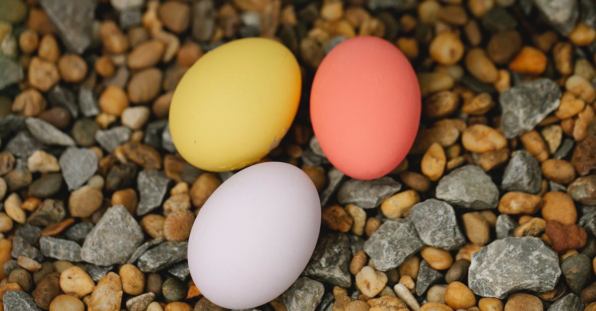 Can someone please give an explanation of different egg preparations? - Colorful Easter eggs on pebble