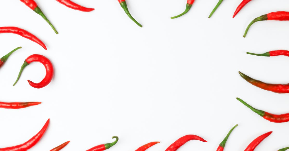 Can whole chilli peppers be frozen? - Close-Up Photo of Chili Peppers on a White Surface