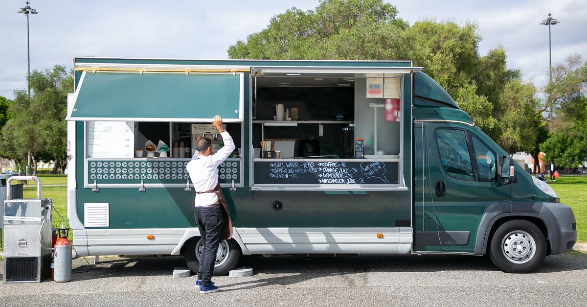 Can you cook with a partially healed open wound? [closed] - Back view full body of anonymous male worker opening windows of car with street food parked in park