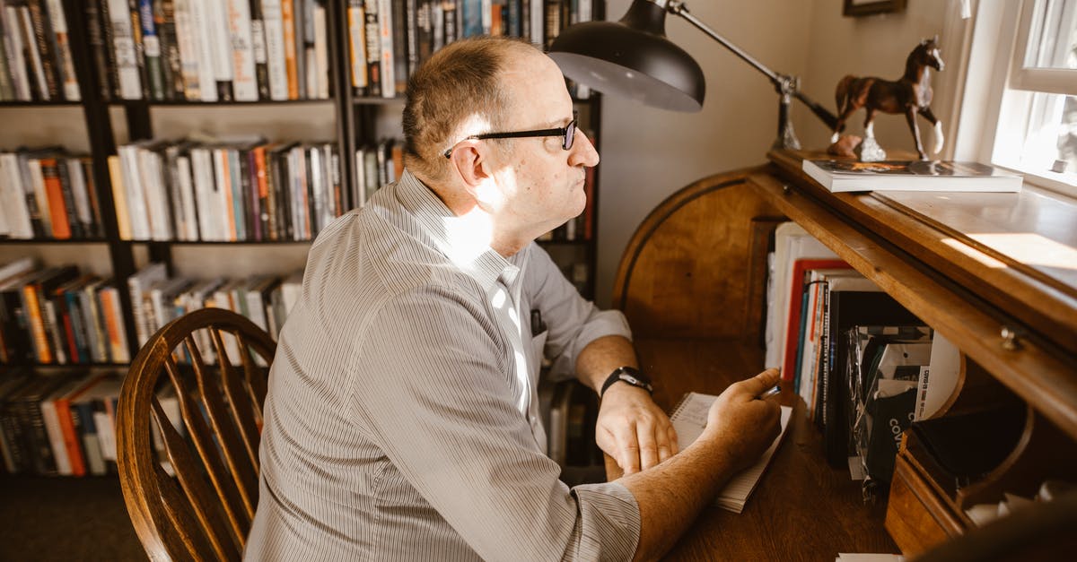 Can you extend shelf life by reheating? - Man in White and Gray Pinstripe Dress Shirt Sitting on Brown Wooden Chair