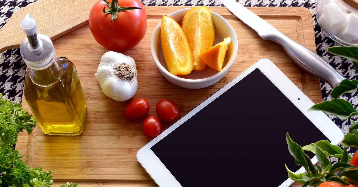 Can you have straight up garlic oil? - White Ipad Near Bowl With Orange