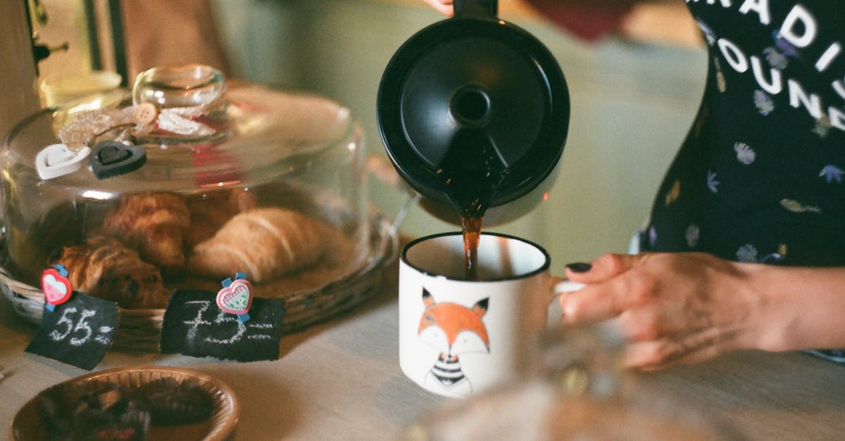 Can you make croissants with compound butter? - Person Pouring Coffee on White Ceramic Mug