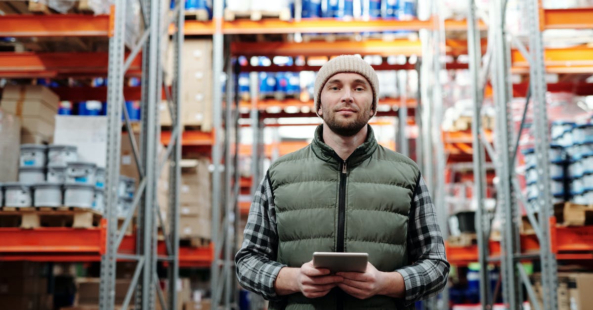 Can you store dissolved rennet tablets? - Man in Bubble Jacket Holding Tablet Computer