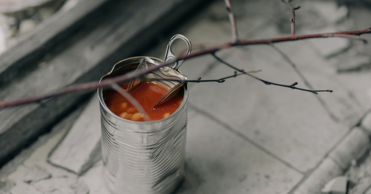 Canned cubed tomatoes vs crushed - Silver Wire Spool on White Textile