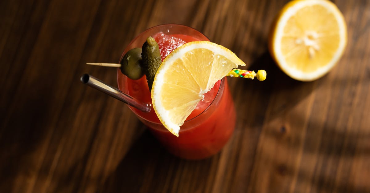 Canned Stewed Tomatoes without lemon juice - Sliced Lemon on Red Ceramic Bowl