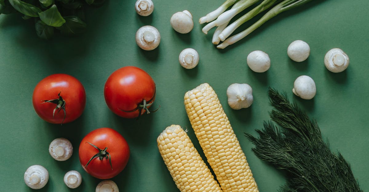 Canned tomatoes for fresh - Corn and Red Tomato on Green Table