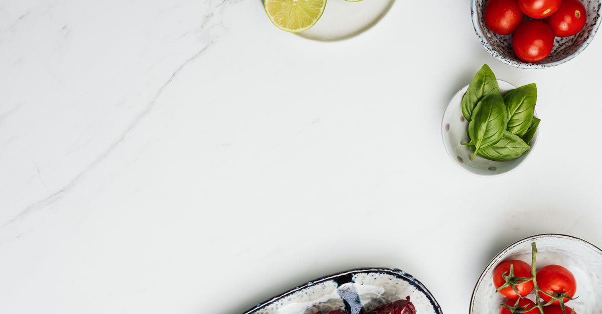 Canned tomatoes for fresh - Sliced Lemon on White Table